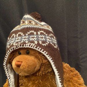 Brown fun winter hat with pom pom